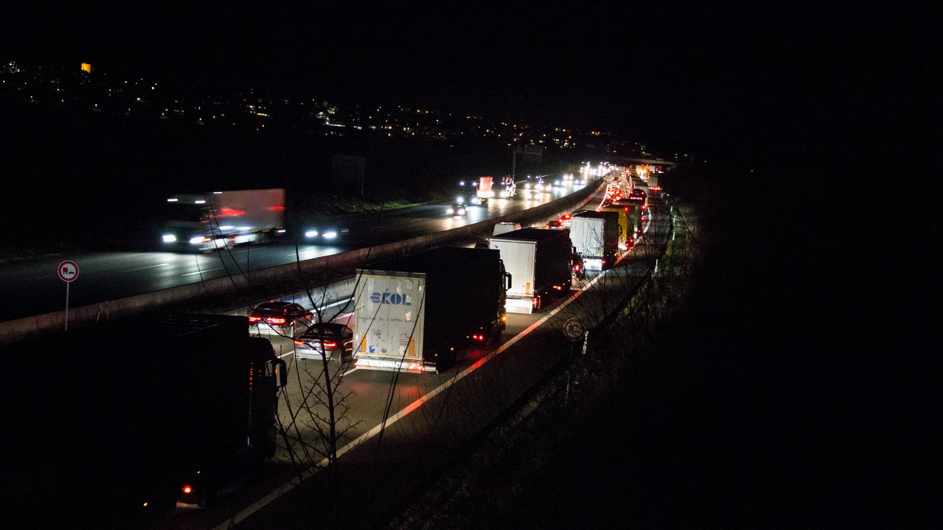 Emergency tow truck on highway at night